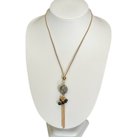 Bijoux | Collier pendentif une bille marbrée et des chaînes dorées garnies de pierres noires