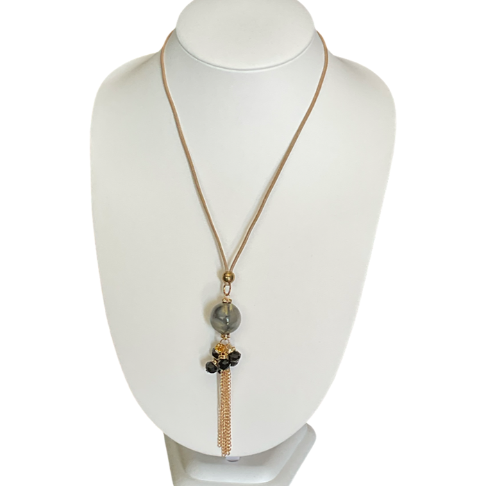 Bijoux | Collier pendentif une bille marbrée et des chaînes dorées garnies de pierres noires