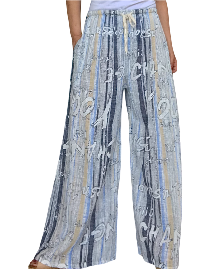 Pantalon palazzo rayé bleu marin, beige, bleu ciel et blanc avec des lettres blanches taille élastique