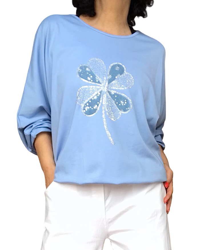 T-shirt manche longue bleu ciel avec une fleur scintillante