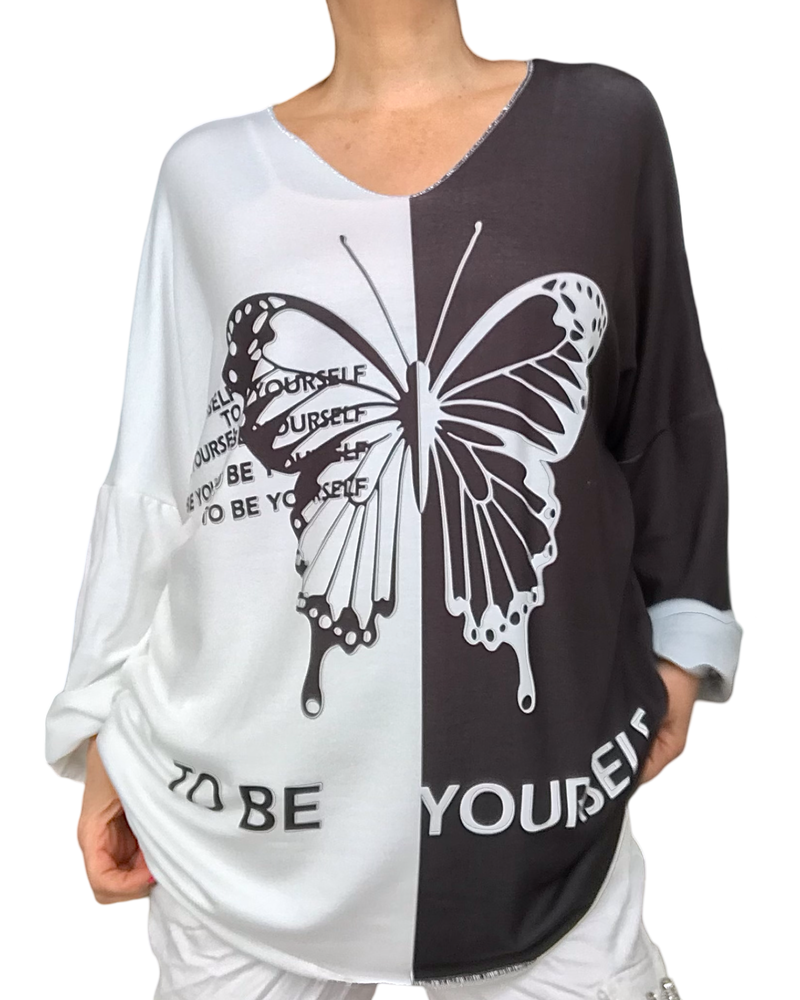 T-shirt col en V color bloc noir et blanc avec un gros papillon