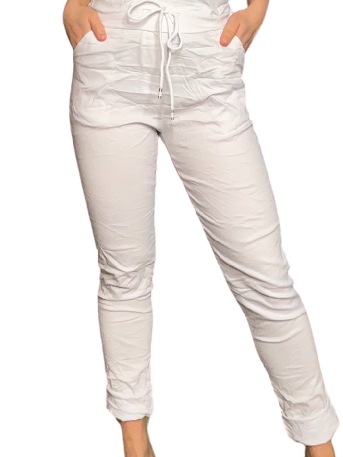 Pantalon blanc pour femme à taille élastique avec cordon.