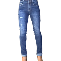 Jeans bleu skinny extensible avec des trous pour femme avec soulier